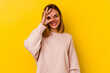 © Asier - Young caucasian skinny woman isolated on yellow background excited keeping ok gesture on eye.