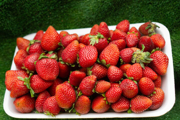 Strawberries on sale in a street bazaar. Red ripe strawberry background.