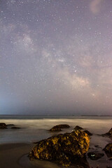 Wall Mural - the milky way rises over the atlantic ocean