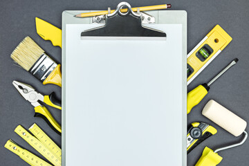 Canvas Print - different working tools for house renovation with blank clip board. top view, copy space.