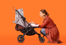 Woman And Her Cute Baby In Stroller On Color Background