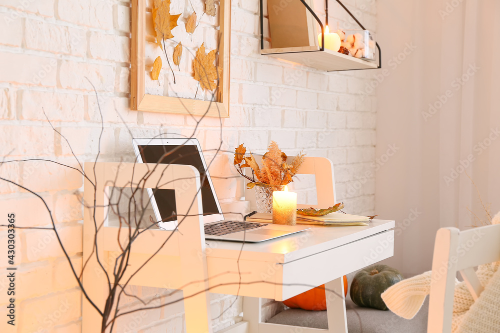 Stylish interior of modern room with autumn decor