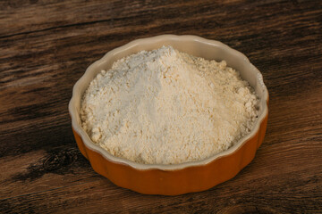 Wheat flour heap in the bowl