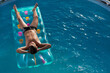 © aneduard - teen boy in the pool, floats on an inflatable mattress, top view