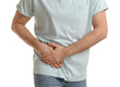 © New Africa - Man suffering from acute appendicitis on white background, closeup