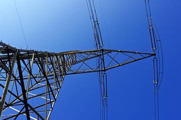 Poster - Low angle shot of power lines on the blue sky background