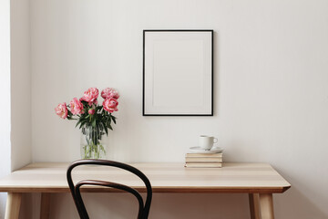 Wall Mural - Living room, indoor still life. Empty picture frame mockup on beige wall. Wooden table and old chair. Glass vase with pink peonies bouquet. Elegant working space, home office concept. Interior design.