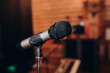 © Евгений Александров - microphone on the stand on the background of the holiday