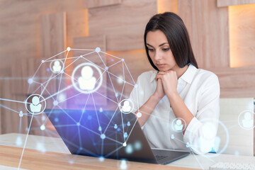 Wall Mural - attractive businesswoman in white shirt at workplace working with laptop to hire new employees for i
