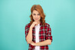 © Olena - smiling redhead woman with curly hair in checkered casual shirt, trend
