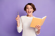 © deagreez - Photo portrait of smart female writer keeping pen got idea planner isolated on vibrant purple color background