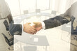 © Pixels Hunter - Double exposure handshake of two businessmen on conference room interior background, collaboration and cooperation concept