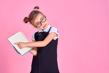 primary school girl in uniform, round glasses without lenses hol