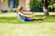 © oksix - Active little girl makes a somersault on the backyard