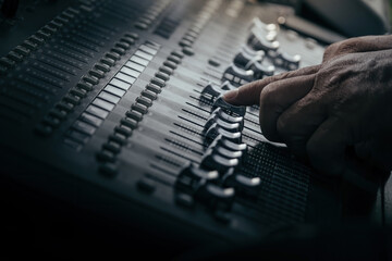 audio sound mixer controller at studio in dark background