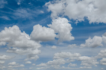 Wall Mural - white, fluffy clouds in blue sky. background from clouds.