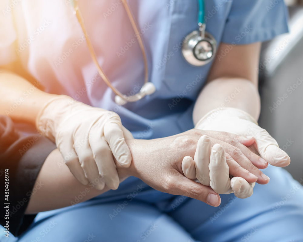 Surgeon, surgical doctor, anesthetist or anesthesiologist holding patient's hand for health care trust and support in professional ER surgical operation, medical anesthetic safety, healthcare concept