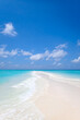 Beautiful sandbank under blue sky and white clouds on India ocean