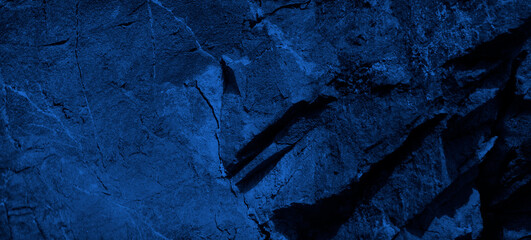 Wall Mural - dark blue stone background. toned rock texture background with copy space for design. web banner.