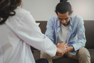 men talk with a psychologist during talking therapy stressed mental health at office