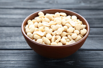 Poster - Peanuts in bowl on black wooden table