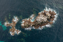 Guano From Nesting Seabirds Covers Rocks Off Lands End, West Cornwall, UK