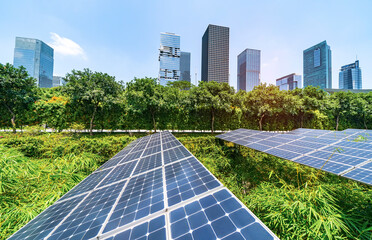 Wall Mural - ecological energy renewable solar panel plant with urban landscape landmarks