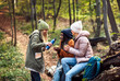 © Zoran Zeremski - Three female friends having fun and enjoying hiking in forest.
