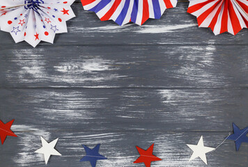 Wall Mural - Decorations for 4th of July day of American independence, flag, candles, straws, paper fans. USA holiday decorations on a wooden background, top view, flat lay