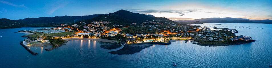 Wall Mural - Aerial panoramic dusk view of beautiful Airlie Beach in Queensland Australia