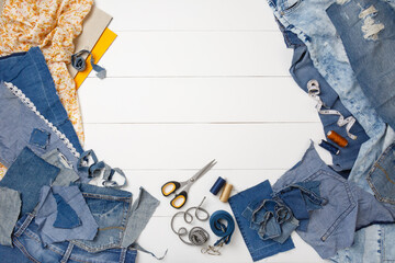 upcycle old denim garbage. recycling old jeans. old blue jeans cut pieces and sewing materials ready
