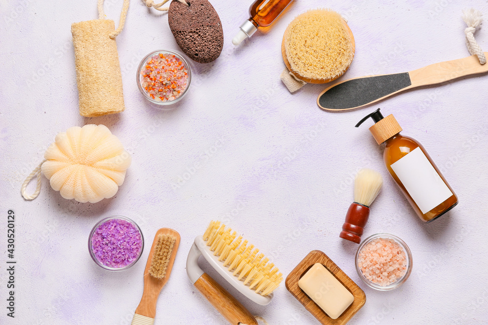 Frame made of different bath supplies on color background