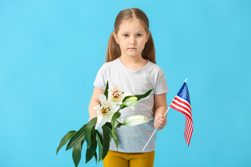 Little girl with USA flag and flowers on color background. Memorial Day celebration