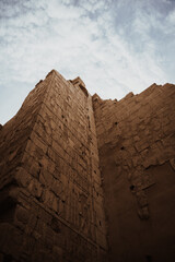 Wall Mural - Low angle shot of the walls of the Luxor Temple under the sunlight in Egypt