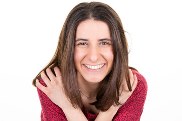 Beautiful Smiling brunette woman posing cute smile in studio white hand on shoulder good mood