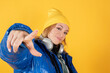 rapper woman with headphones on yellow background