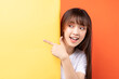 © Timeimage - Young asian girl overlapping yellow background on orange background