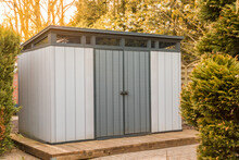 Modern Summer House Made Of Plastic. Gray Garden Shed For Garden Tools.	Gray Garden Shed Made Of Plastic. Modern Tool Shed