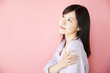 Beautiful asian woman on pink background