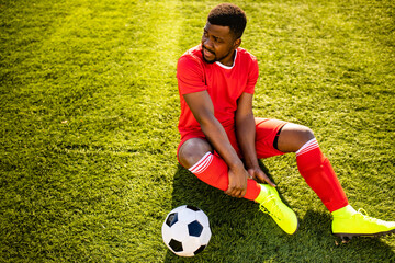 authentic happy football trainer working out outdoor in summer great day