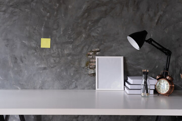 Workspace Mock up marble tabletop with picture frame , pencils. copy space desk with copy space for products display montage