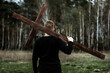 The man carries the cross. Сarry the cross. Man believes in God. Hope in God.