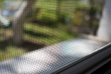 White mosquito wire mesh, net. close-up. Blur. Selective focus