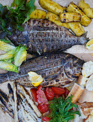 Wall Mural - Tasty grilled fish dorado with lemon and pineapple