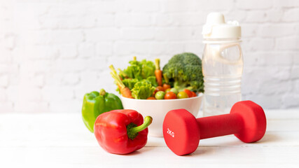 Wall Mural - Close up dumbbell.  Diet Health food and lifestyle health concept. Sport exercise equipment workout and gym background with fresh salad for fitness style