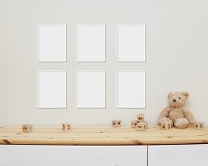 6 blank vertical frames mockup on wall for nursery wall art display, baby room six white frames mock up, wooden shelf, soft toys and wooden toys on shelf.