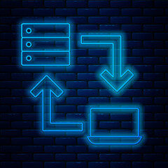 Wall Mural - Glowing neon line Online working icon isolated on brick wall background. Freelancer man working on laptop at his house. Remote work. Distant job concept. Vector