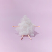 Plastic Toy Doll Covered With Wool On Purple Background. Minimal Composition.