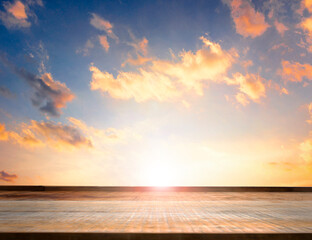 Wall Mural - empty top of wooden table and view of sunset background