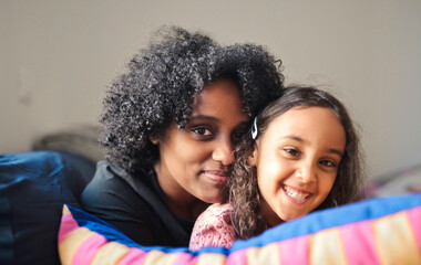 portrait of mother and daughter embraced